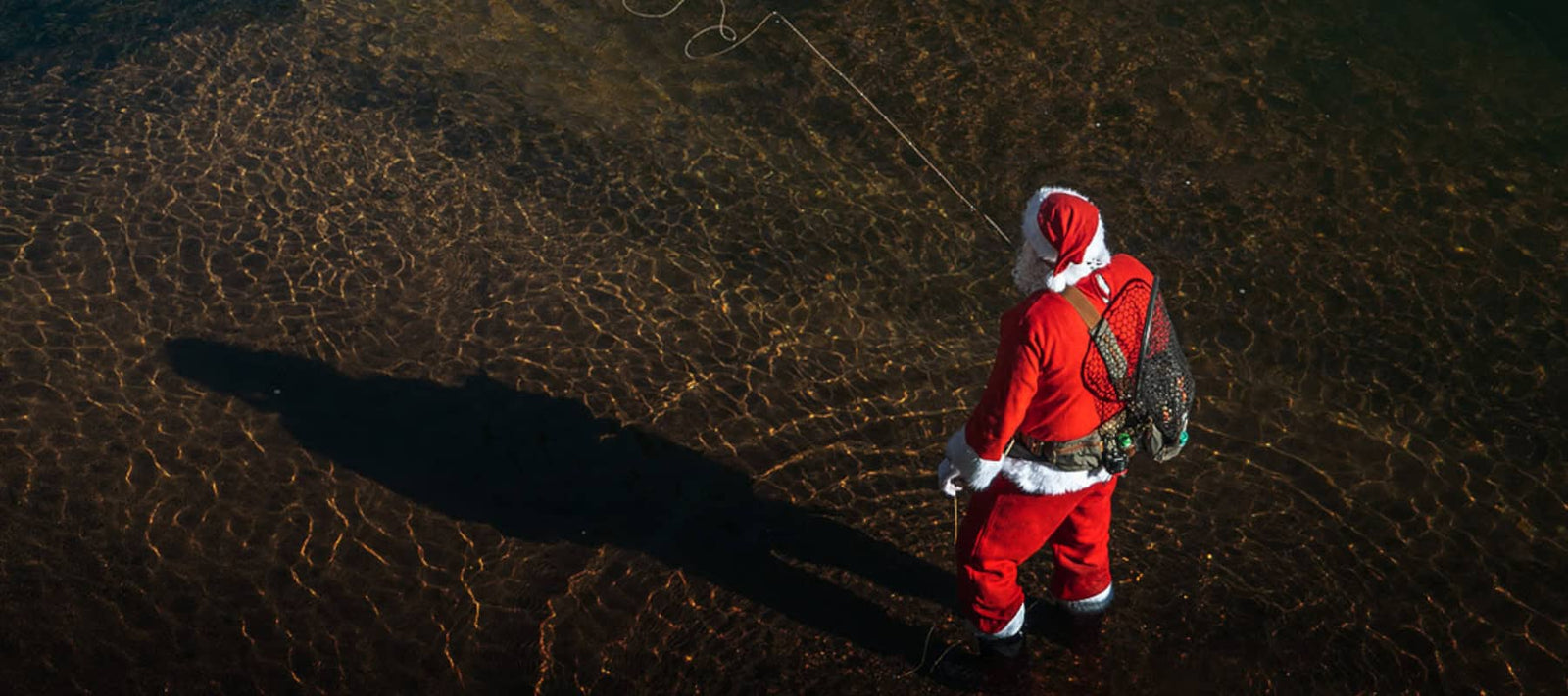 Umpqua Sale on Fishing Gear with Santa Fishing in the River