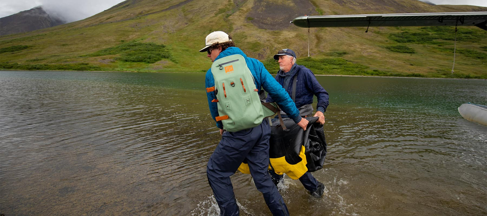 Loading Fishpond Thunderhead Submersible Packs & Bags Off The Plane