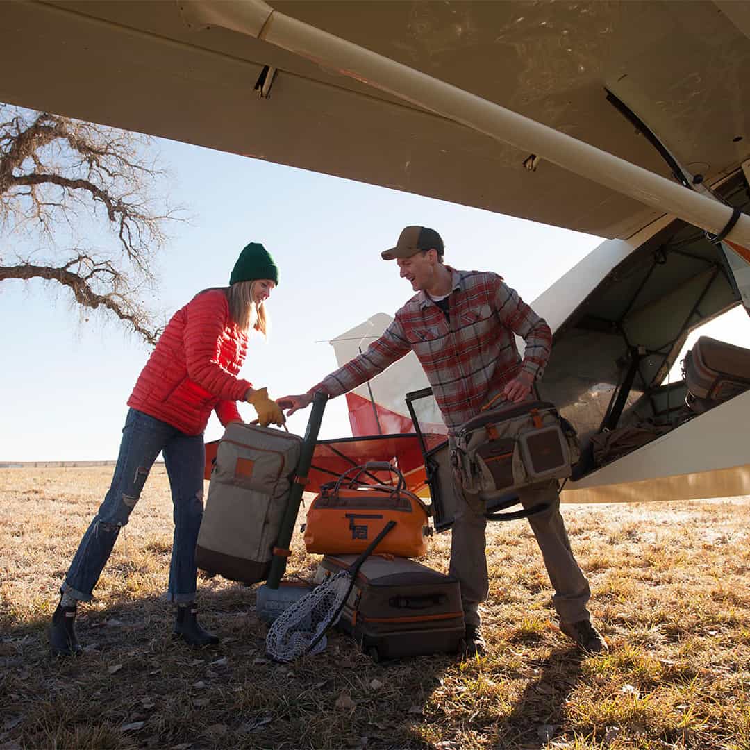 816332011245 Fishpond Green River Fly Fishing Travel and Gear Bag Unloading A Plane