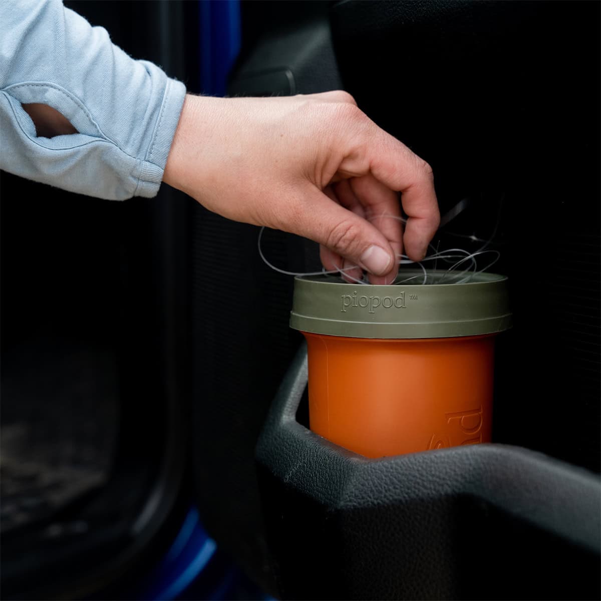 816332012105 Fishpond Largemouth PIOPOD Cutthroat Orange Micro Trash Cupholder Container With Fishing Line In Car Door