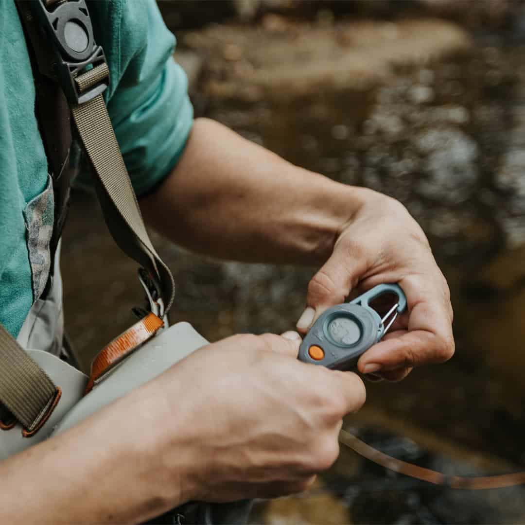 816332016202 Fishpond Riverkeeper Digital Fishing Thermometer In Hand On Stream