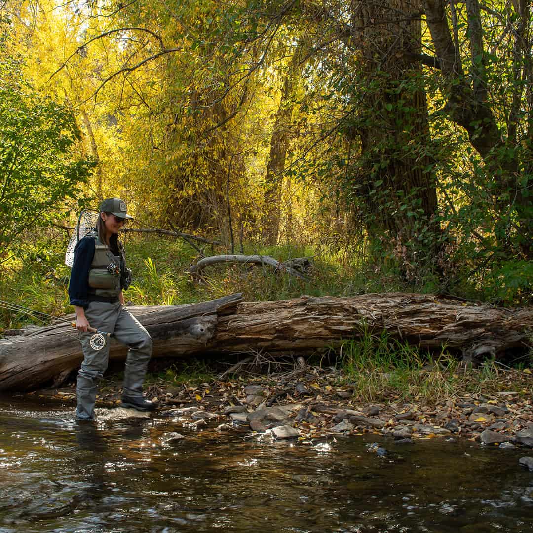 816332016790 Fishpond FlyLite Women's Fly Fishing Vest Walking Riverside
