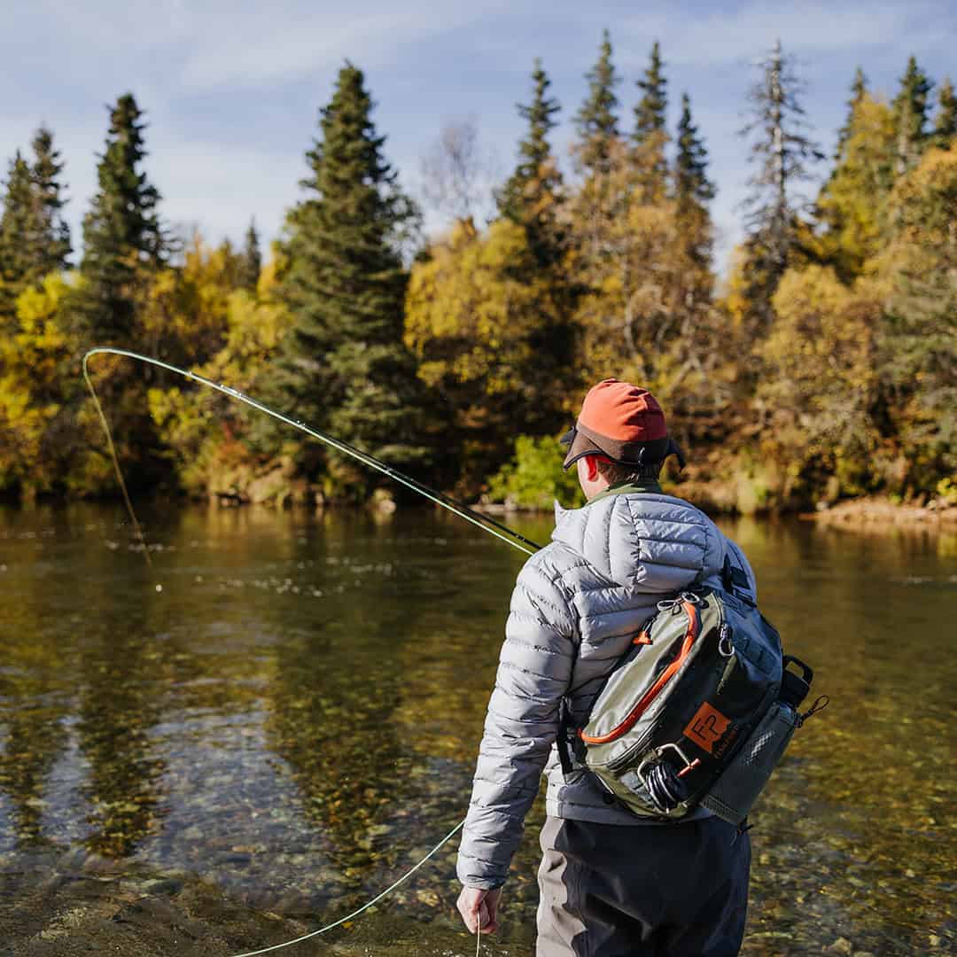 New 2025 816332016233 Fishpond Stormshadow Sling Pack Water Resistant Ambidextrous Fly Fishing Sling Pack Hooked Up to fish on river