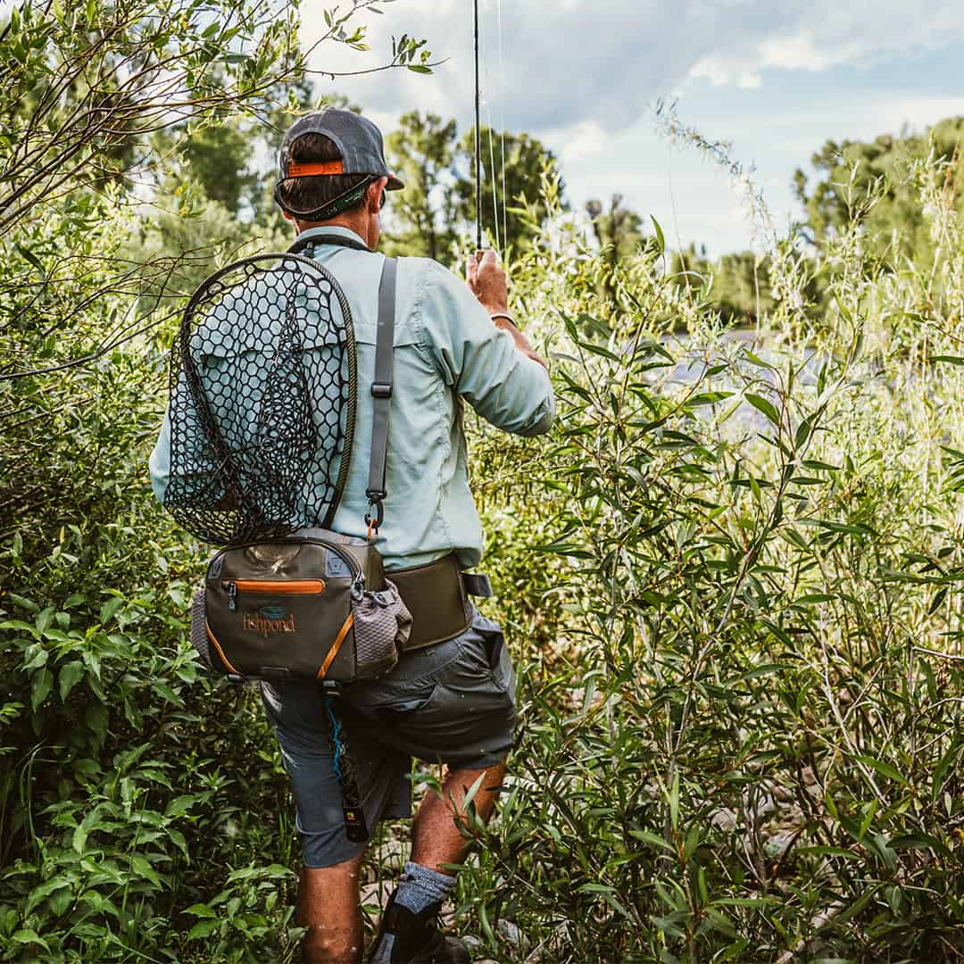 816332015694 EHLP-P Fishpond Elkhorn Lumbar Pack Pebble New Fishpond Waist Pack Front Entering River To Fish