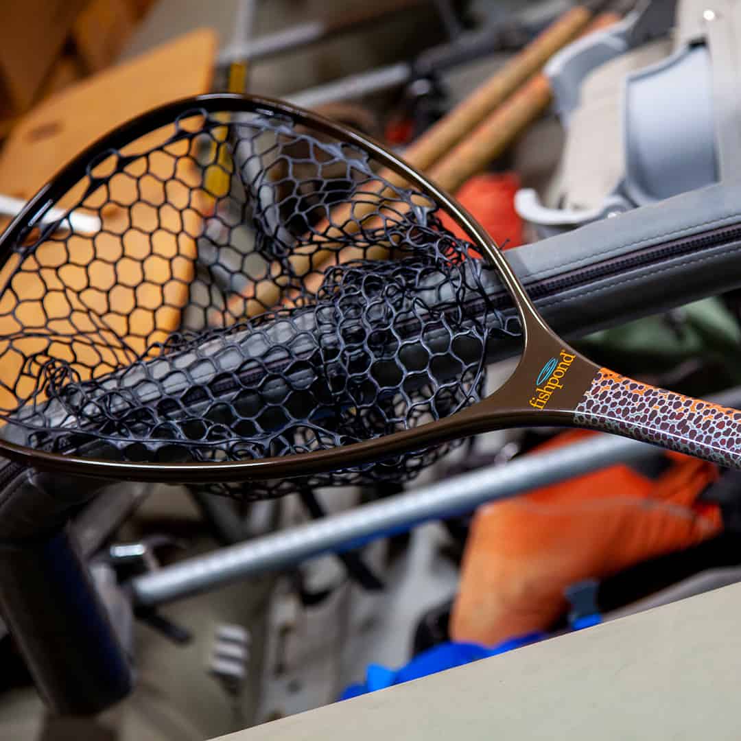 NMLN-SE 816332014925 Fishpond Nomad Mid Length Net Brown Trout Slab Limited Edition On Raft Side