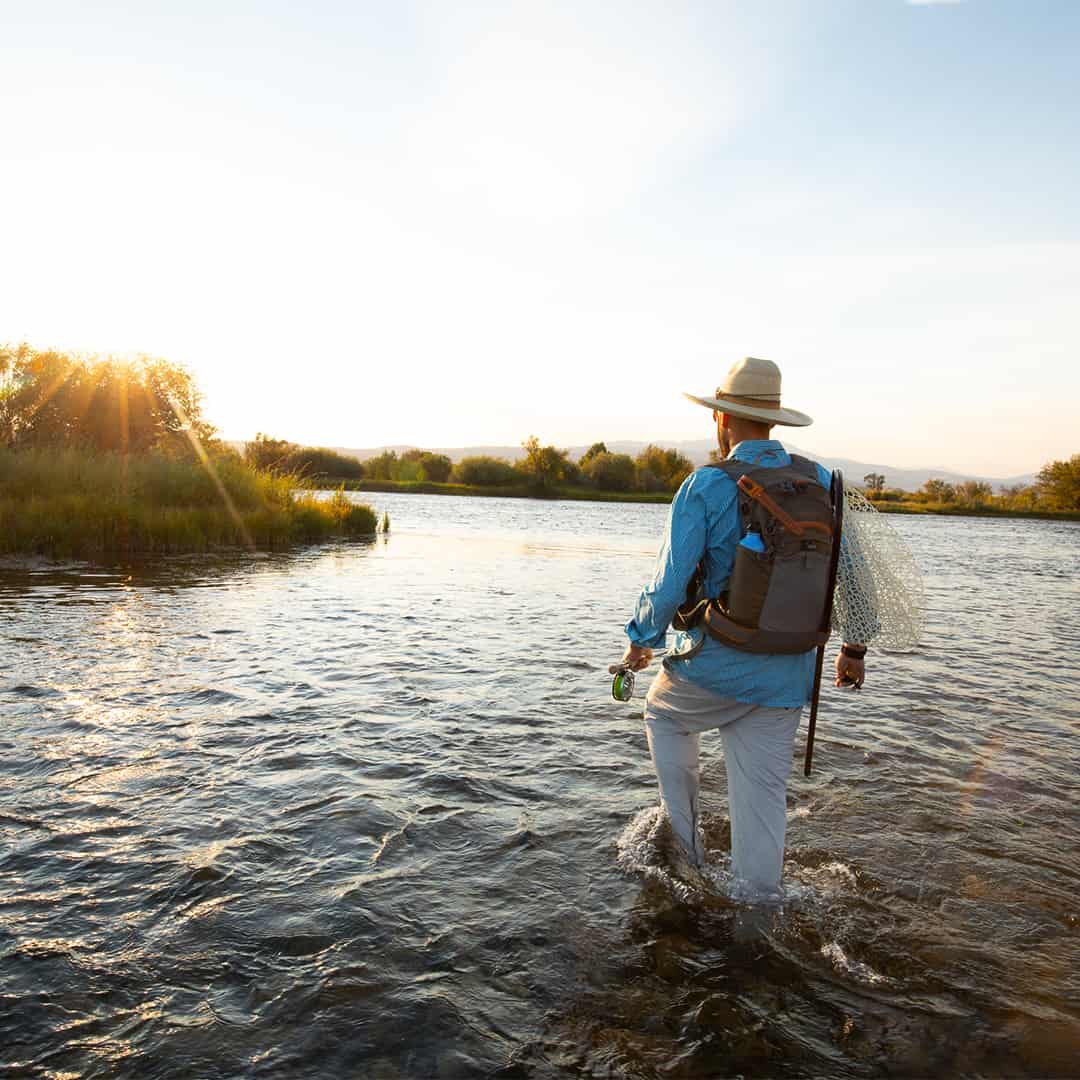 RLTP 816332014963 Fishpond Ridgeline Tech Pack Fly Fishing Vest and Travel Backpack Walking across channel