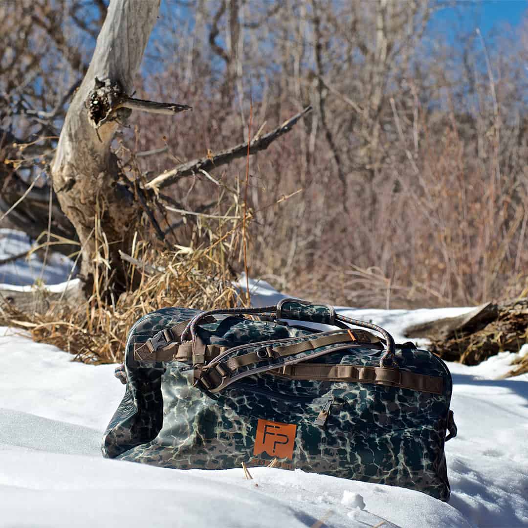TLSD-ERC 816332015137 Fishpond Thunderhead Large Submersible And Waterproof Duffel Bag Newstream Model 2022 Eco Riverbed Camo On The Riverbank