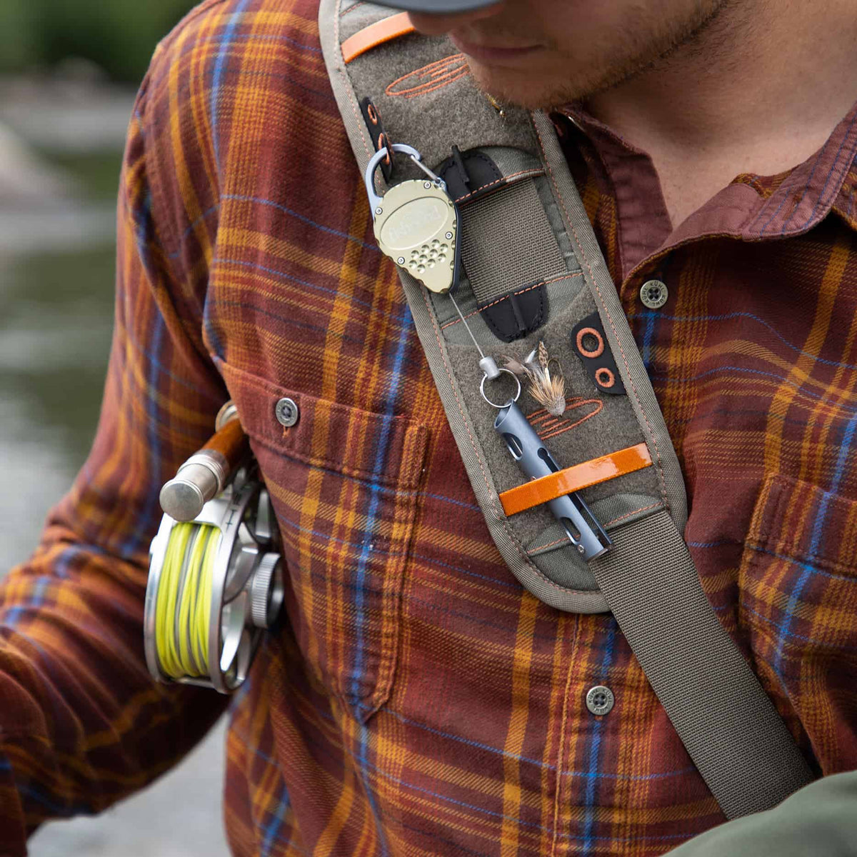 fishpond arrowhead fishing accessory retractor fishing zinger moss color on shoulder pack