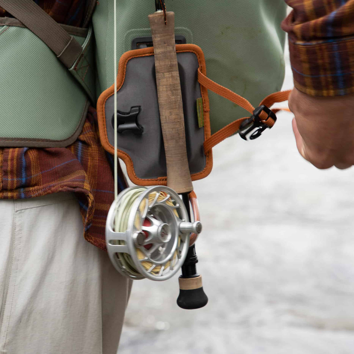 fishpond quikshot rod holder 2.0 attached to fishpond pack release