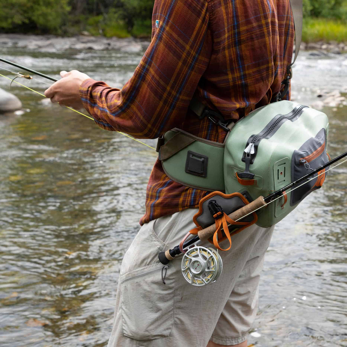 fishpond quikshot rod holder 2.0 attached to fishpond thunderhead lumbar pack