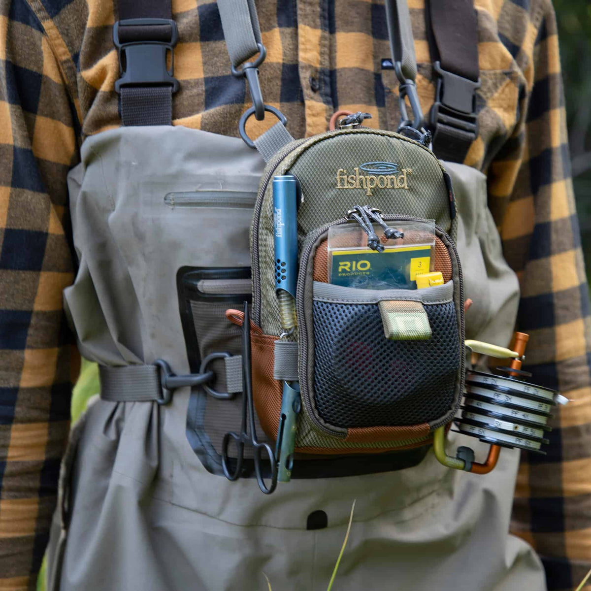 fishpond san juan vertical fishing chest pack sand and saddle brown loaded small fishing chest pack