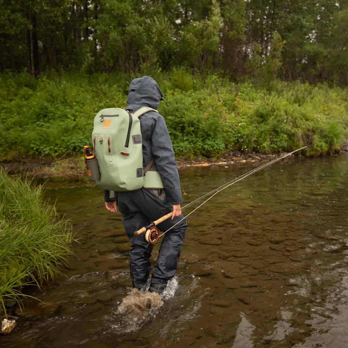 TSB-EY 816332015182 fishpond thunderhead waterproof fly fishing backpack eco yucca walking along water