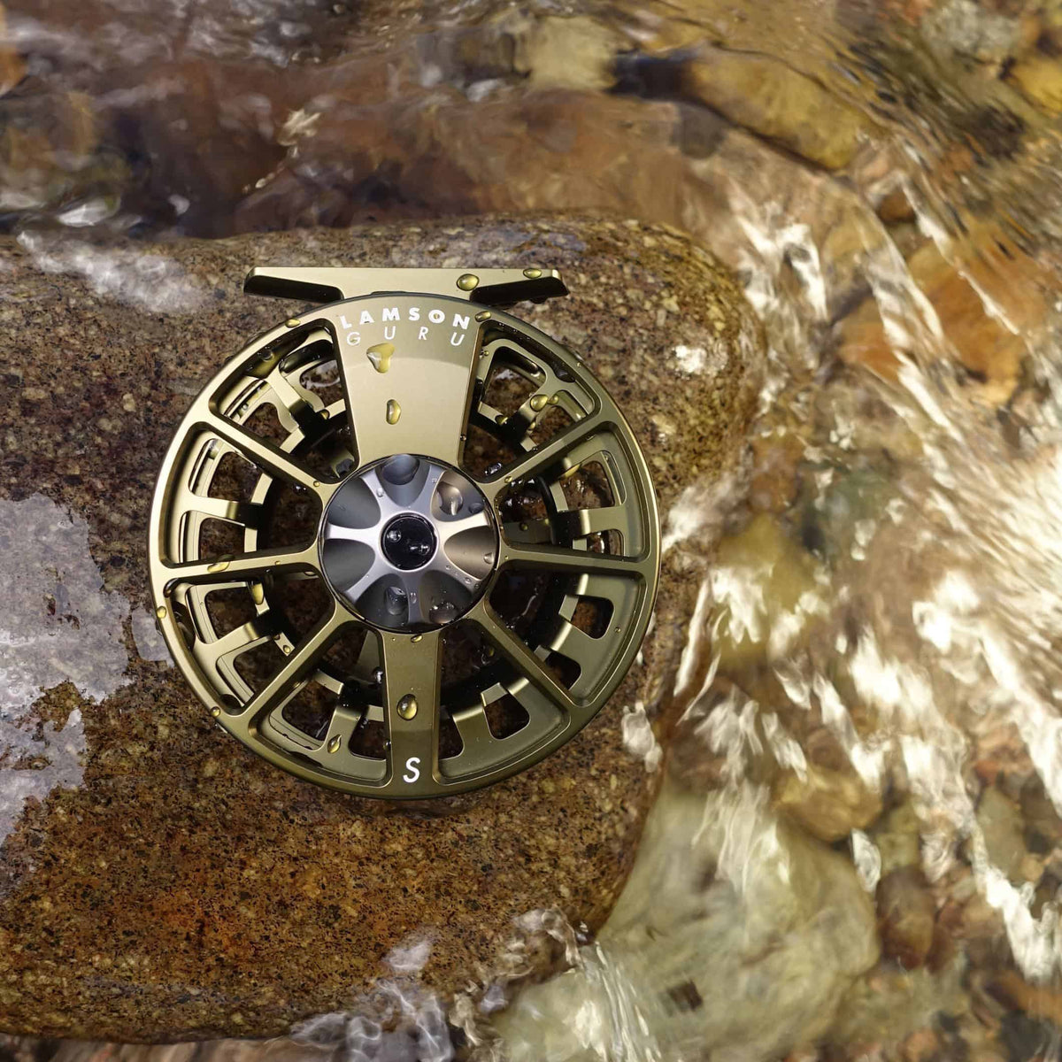 waterworks lamson guru s fly reel og olive green fly fishing reel in water