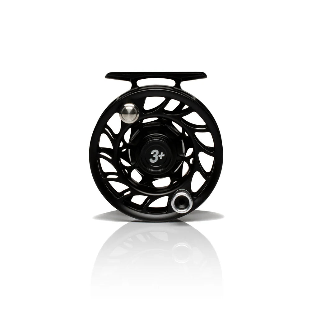 The back of a black fly fishing reel with 'Hatch Iconic 3+' branding on a white background featuring UPC 704715337061