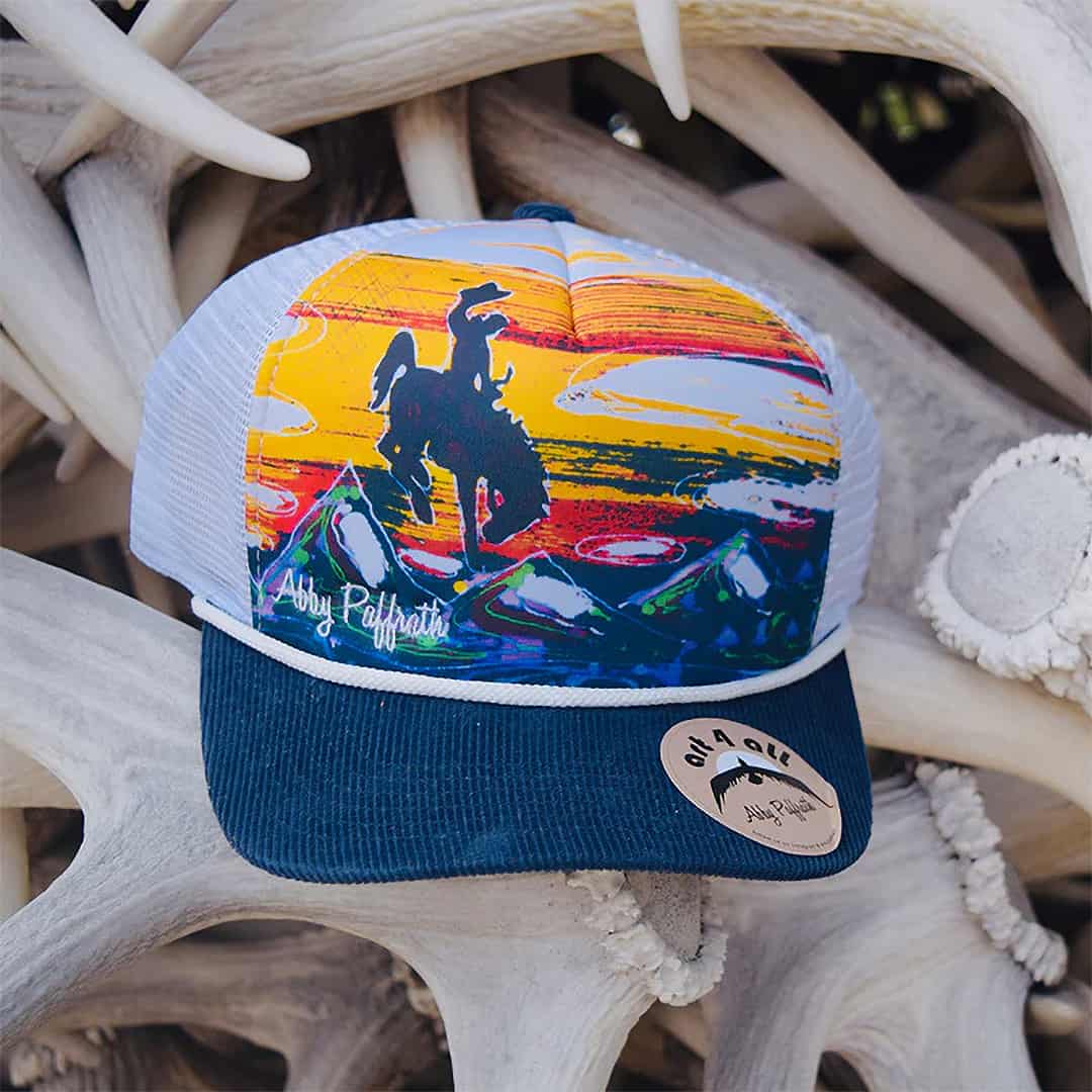 art 4 all let er buck trucker hat by abby paffrath featuring jackson hole on Antlers