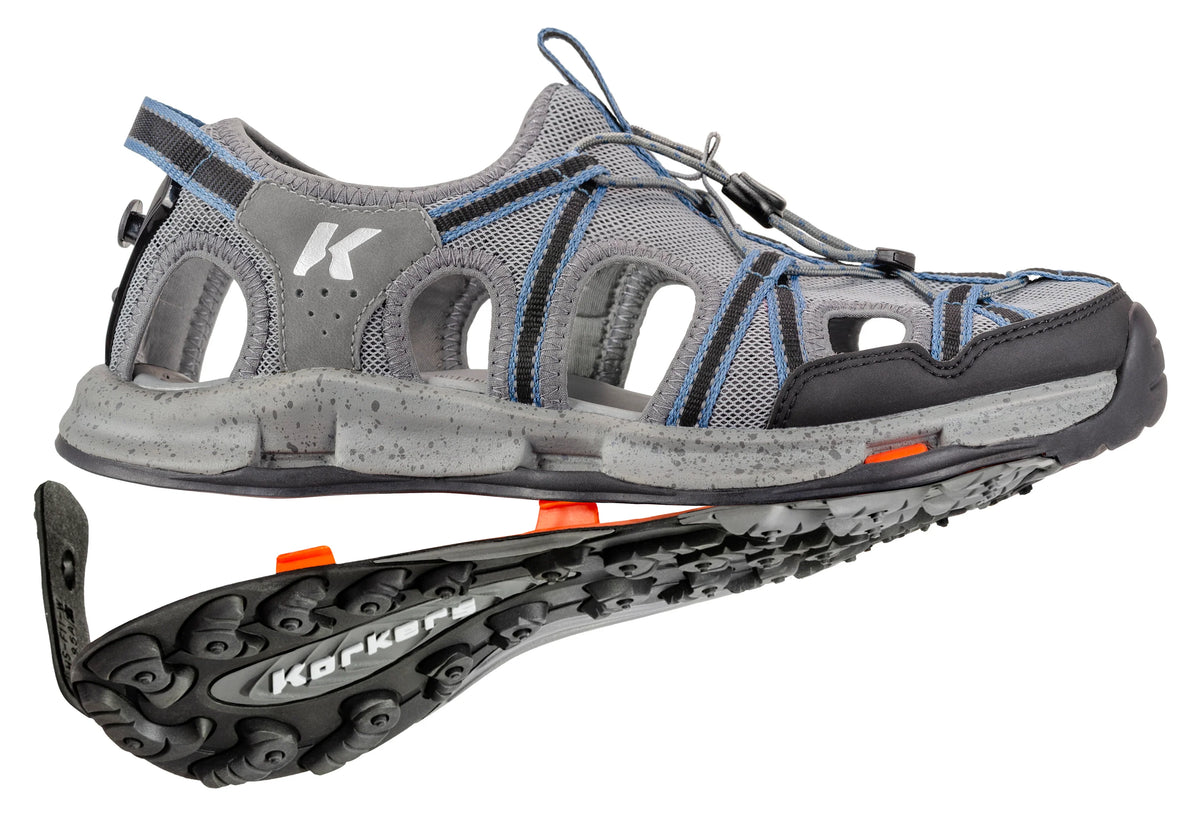 Korkers Men's Swift wet wading sandal with detached Trailtrac outsole showing the interchangeable sole system