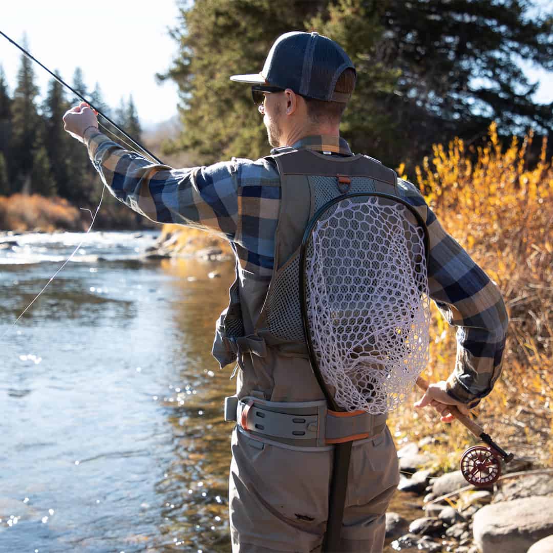 FHV-G 816332014970 Fishpond Flint Hills Fly Fishing Vest Back View With Net Fishing On River