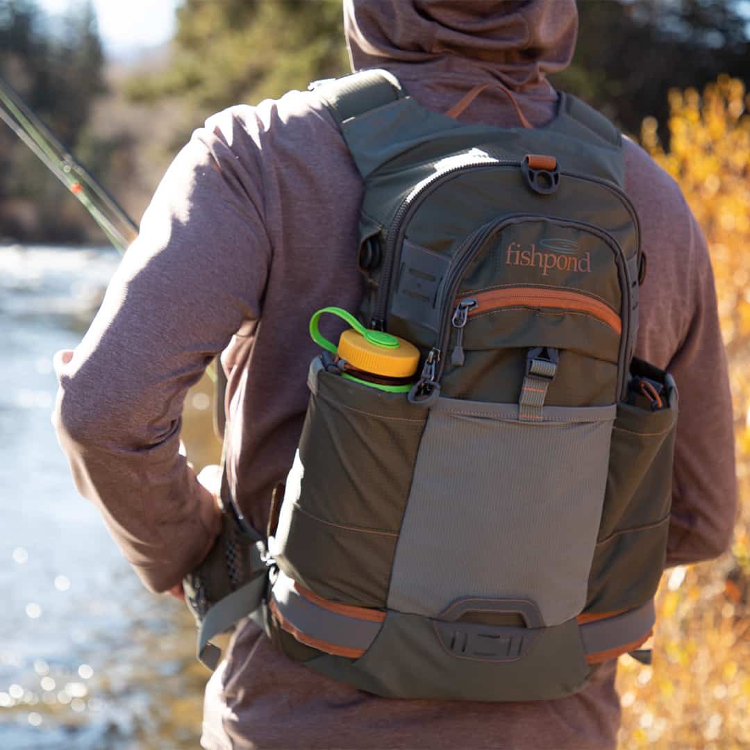 RLBK 816332014956 Fishpond Ridgeline Fishing and Travel Backpack Showing Water Bottle Pocket Detail and Net Connection