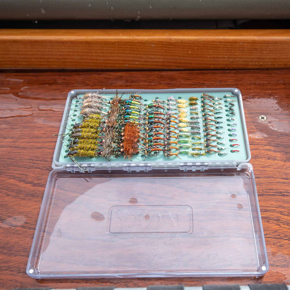 Tacky Original Fly Box Open On Table Loaded With Flies