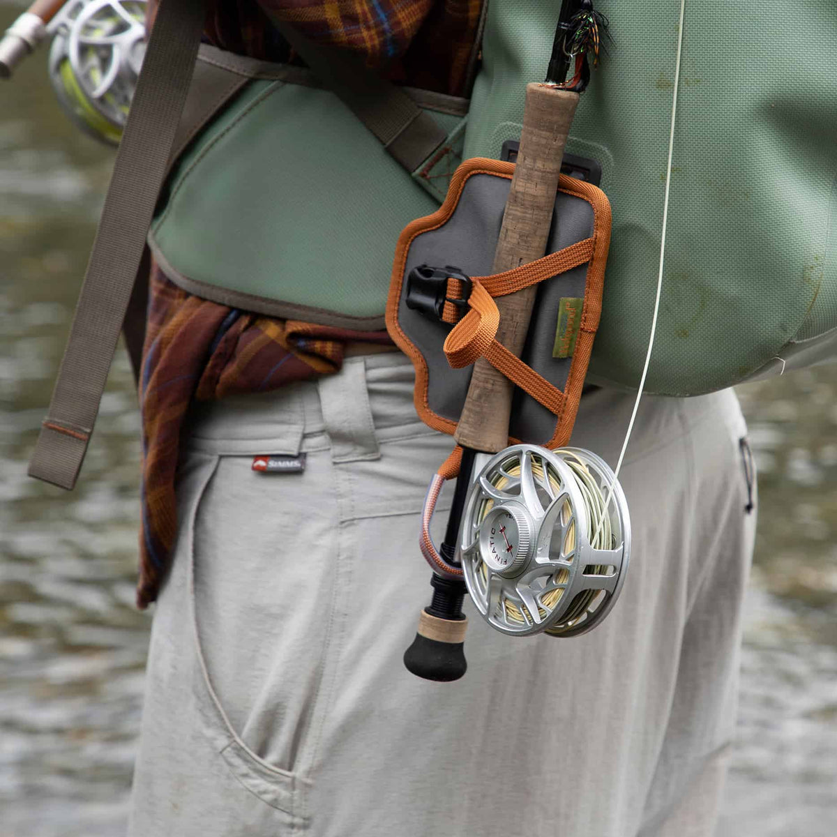 fishpond quikshot rod holder 2.0 attached to fishpond thunderhead pack