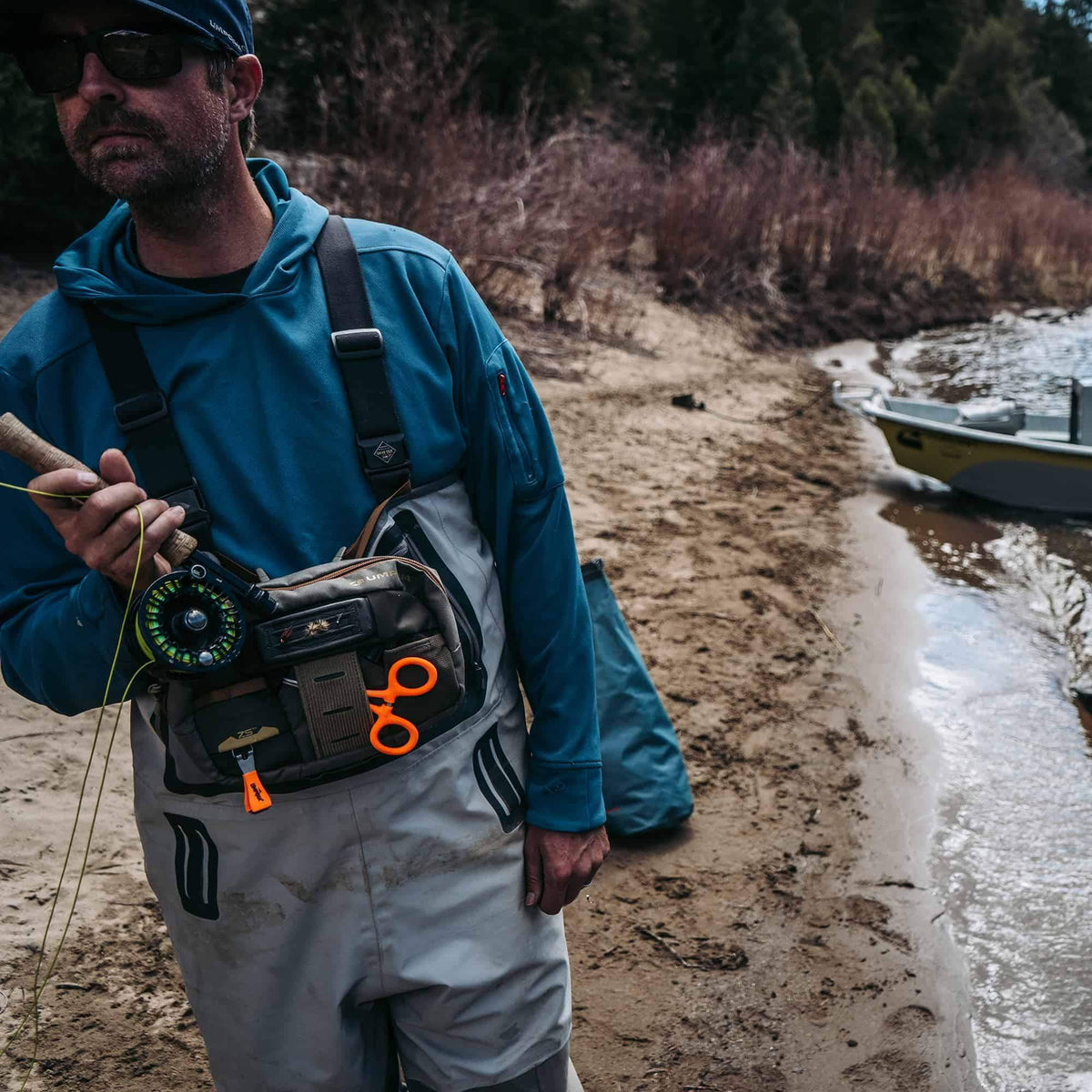 umpqua-zs2-Wader-Fishing-Chest-Pack-Camo-On-The-River-Looking-Square-Opt.jpg